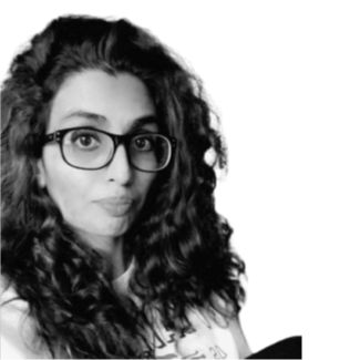 A woman with long curly hair wearing glasses